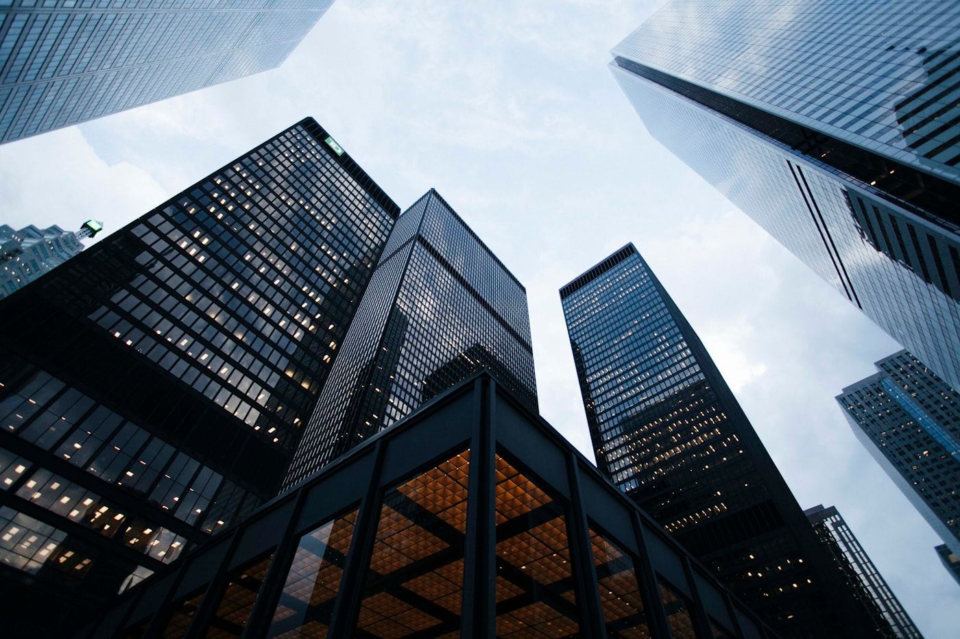 Modern financial-district office towers viewed from below